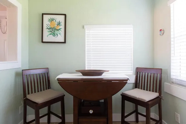 a view of a room with furniture and window