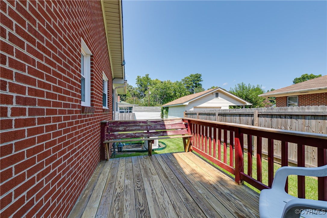 3307 Walnut Street Hopewell, VA 23860 - Photo 13 of 38 a view of a roof deck with wooden floor and fence