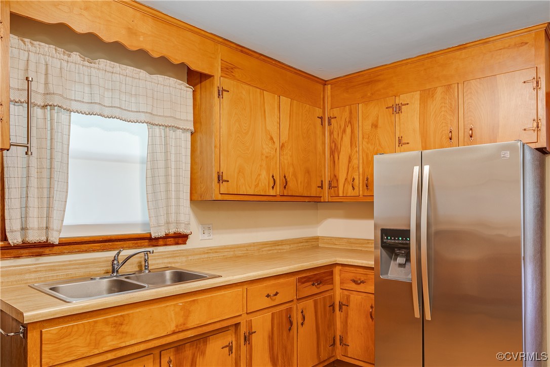 3307 Walnut Street Hopewell, VA 23860 - Photo 22 of 38 a kitchen with stainless steel appliances granite countertop a refrigerator and a sink