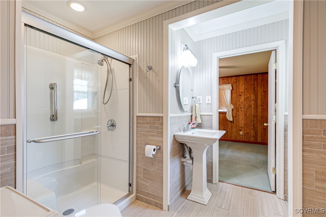 3307 Walnut Street Hopewell, VA 23860 - Photo 29 of 38 a bathroom with a sink mirror toilet and shower