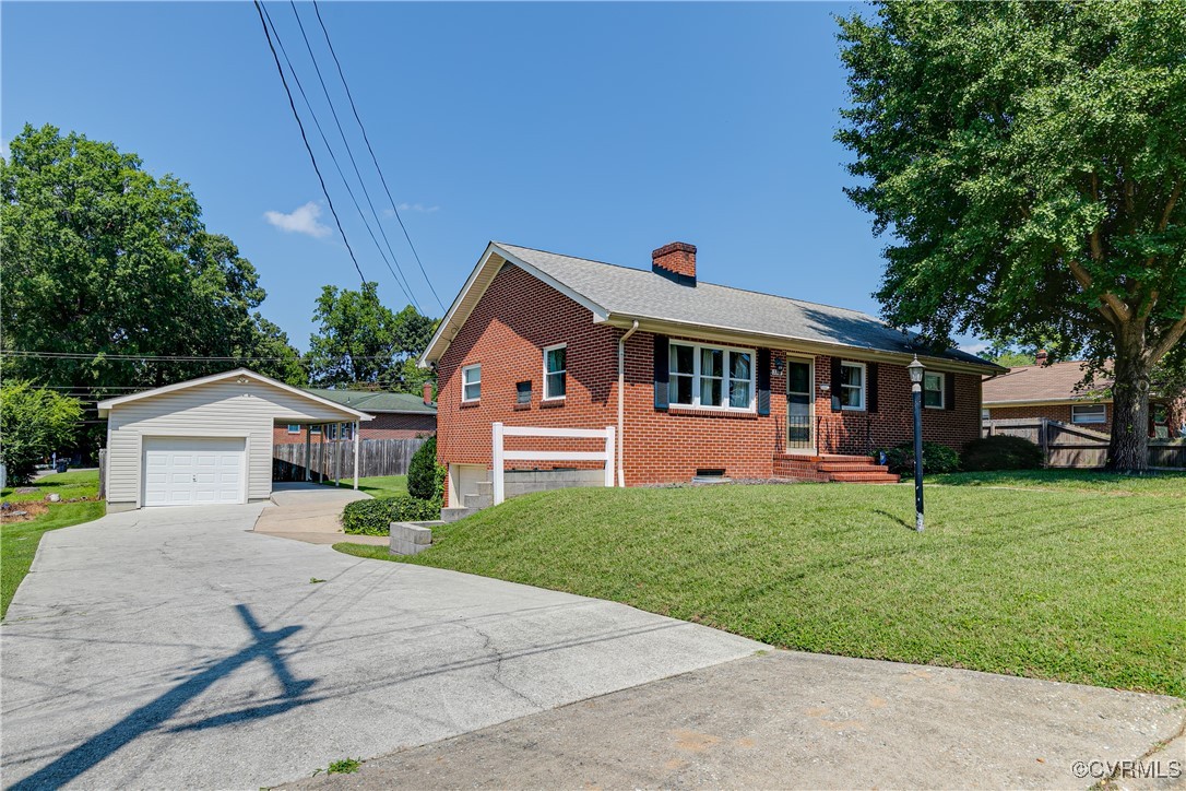 3307 Walnut Street Hopewell, VA 23860 - Photo 3 of 38 a front view of a house with a yard