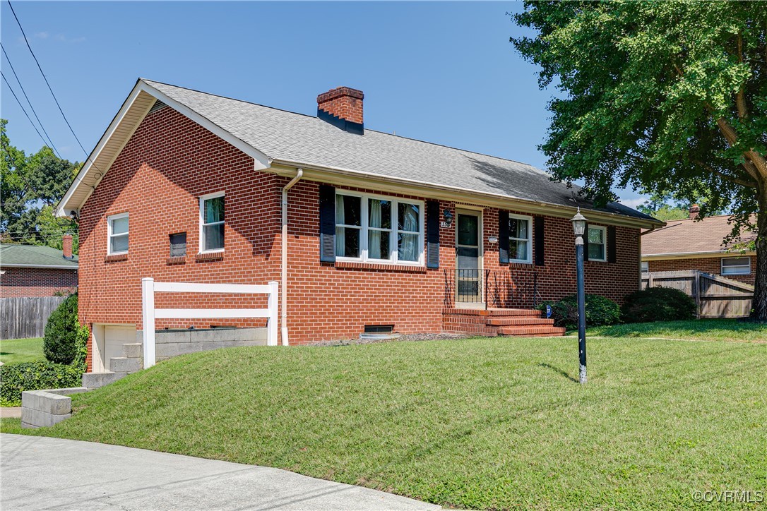 3307 Walnut Street Hopewell, VA 23860 - Photo 4 of 38 a front view of a house with a yard and trees