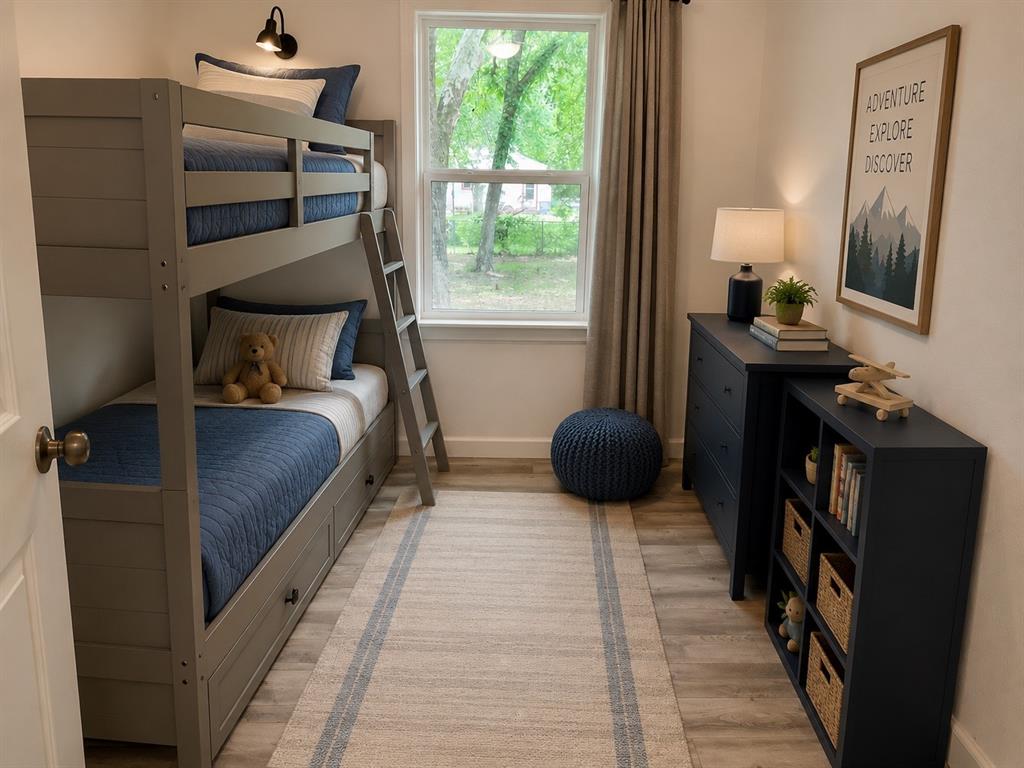 1109 North Howeth Street Gainesville, TX 76240 - Photo 6 of 11 Light wood-finish flooring provides a neutral base for this room featuring a window with natural light, a built-in bunk bed with storage drawers, a dark blue dresser, and a matching dark blue bookshelf