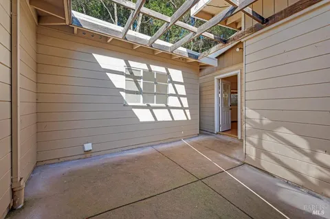 a view of an empty room with wooden walls