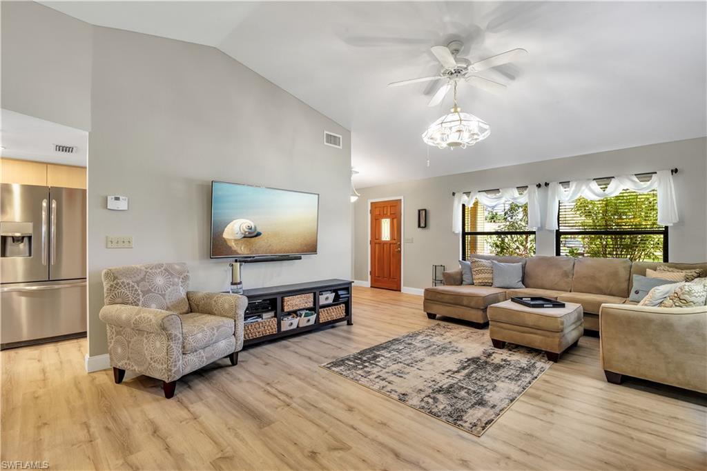 8444 Lemon Road Fort Myers, FL 33967 - Photo 1 of 30 a living room with furniture and a flat screen tv