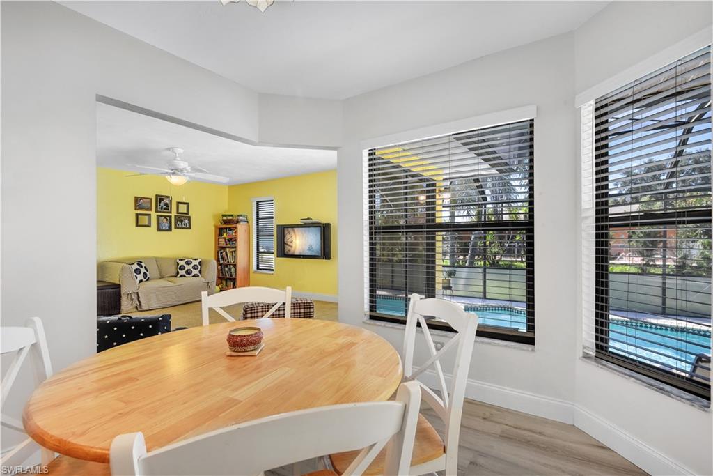 8444 Lemon Road Fort Myers, FL 33967 - Photo 12 of 30 a bedroom with a bed and wooden floor