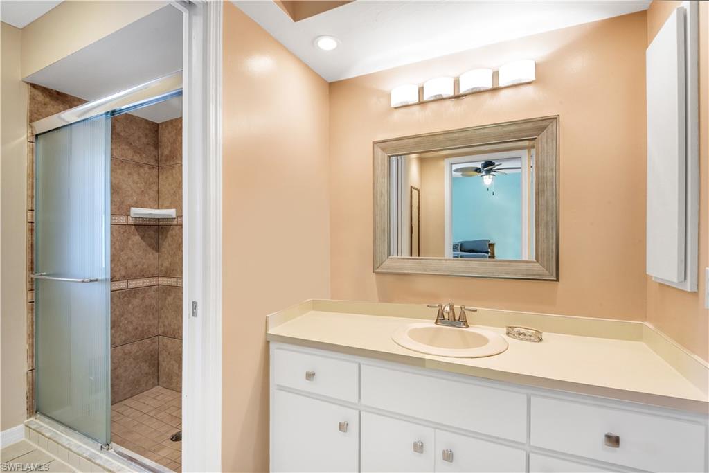 8444 Lemon Road Fort Myers, FL 33967 - Photo 19 of 30 a bathroom with a sink and a mirror