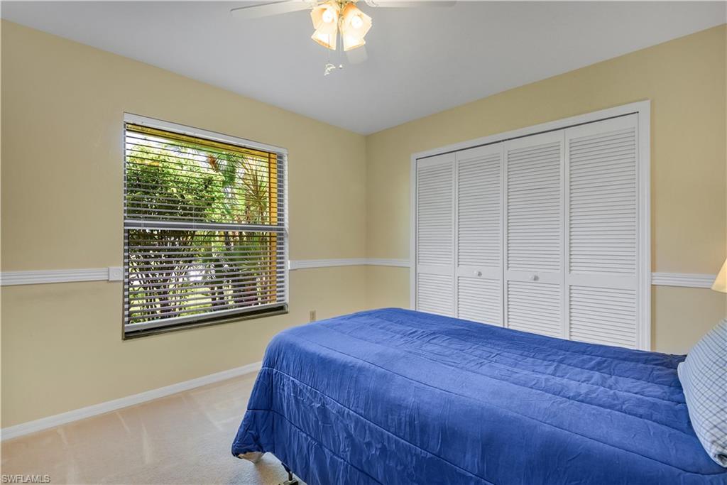 8444 Lemon Road Fort Myers, FL 33967 - Photo 21 of 30 a bedroom with a bed and a window