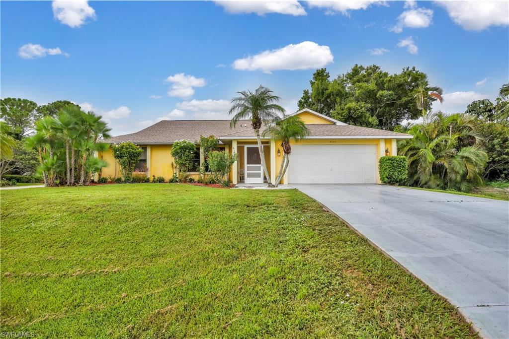 8444 Lemon Road Fort Myers, FL 33967 - Photo 28 of 30 a front view of a house with garden