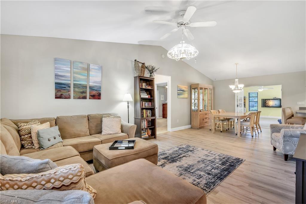 8444 Lemon Road Fort Myers, FL 33967 - Photo 3 of 30 a living room with furniture and wooden floor