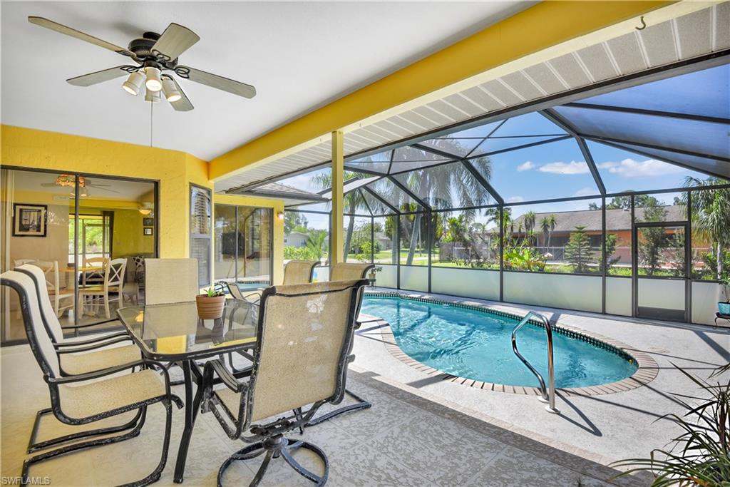 8444 Lemon Road Fort Myers, FL 33967 - Photo 6 of 30 a dining room with furniture and floor to ceiling windows
