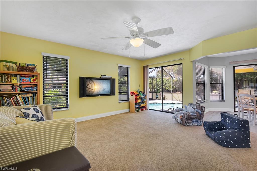 8444 Lemon Road Fort Myers, FL 33967 - Photo 7 of 30 a living room with furniture and a flat screen tv
