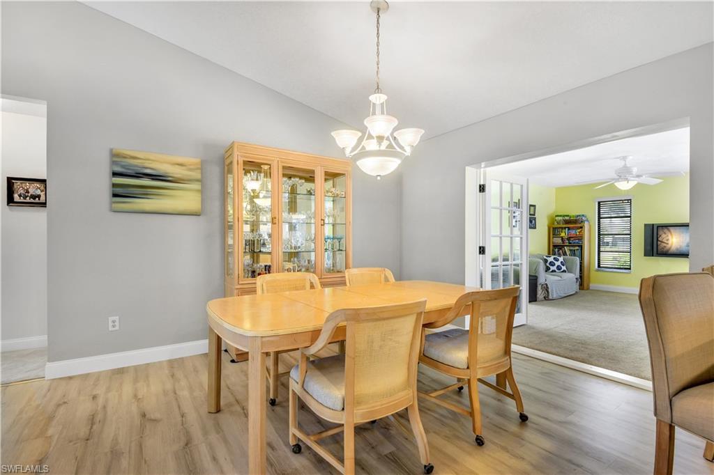 8444 Lemon Road Fort Myers, FL 33967 - Photo 8 of 30 a dining room with wooden floor and breakfast area