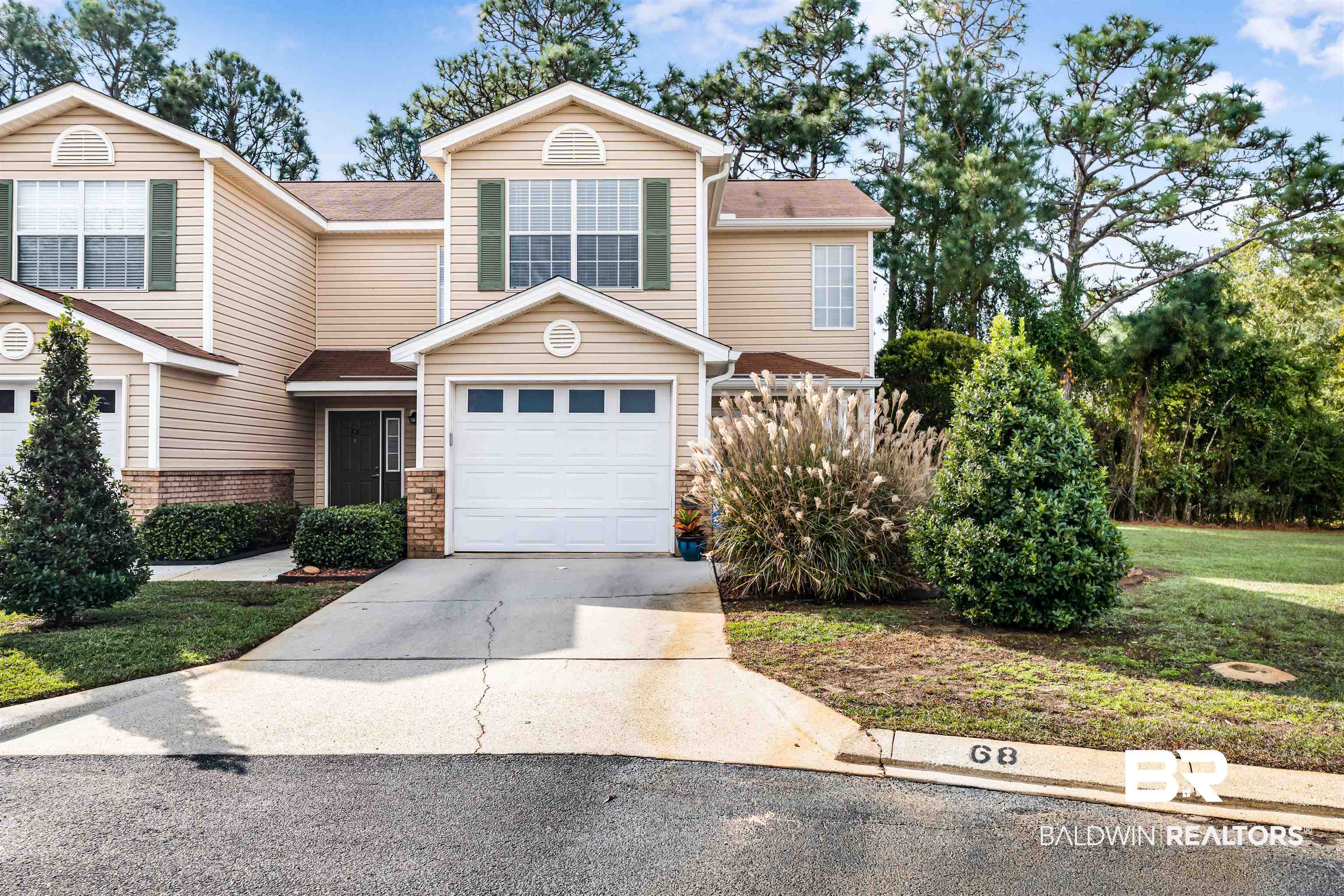 1517 Regency Road, Unit 68 Gulf Shores, AL 36542 - Photo 1 of 43 View of front of home featuring a garage