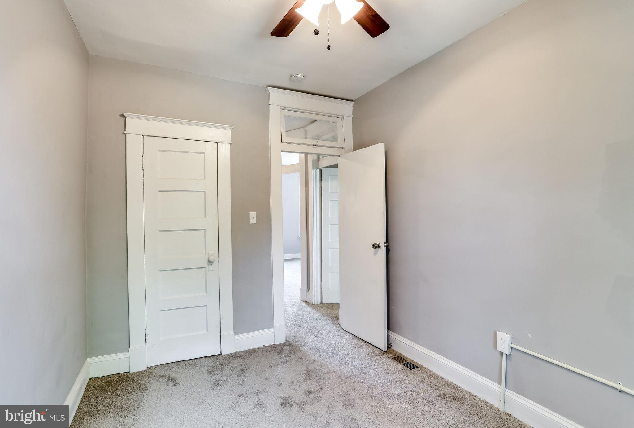 713 Springfield Avenue Baltimore, MD 21212 - Photo 19 of 28 an empty room with a ceiling fan