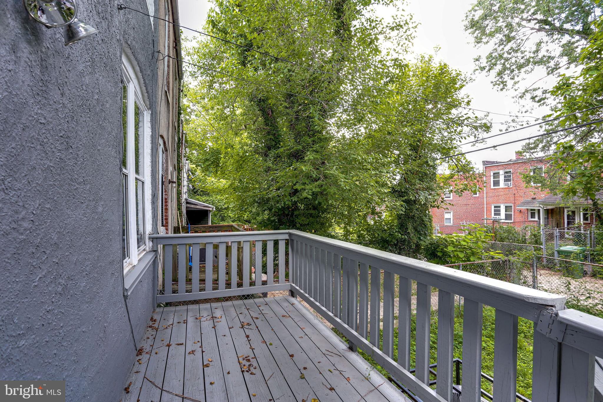 713 Springfield Avenue Baltimore, MD 21212 - Photo 25 of 28 a view of balcony with wooden floor and fence