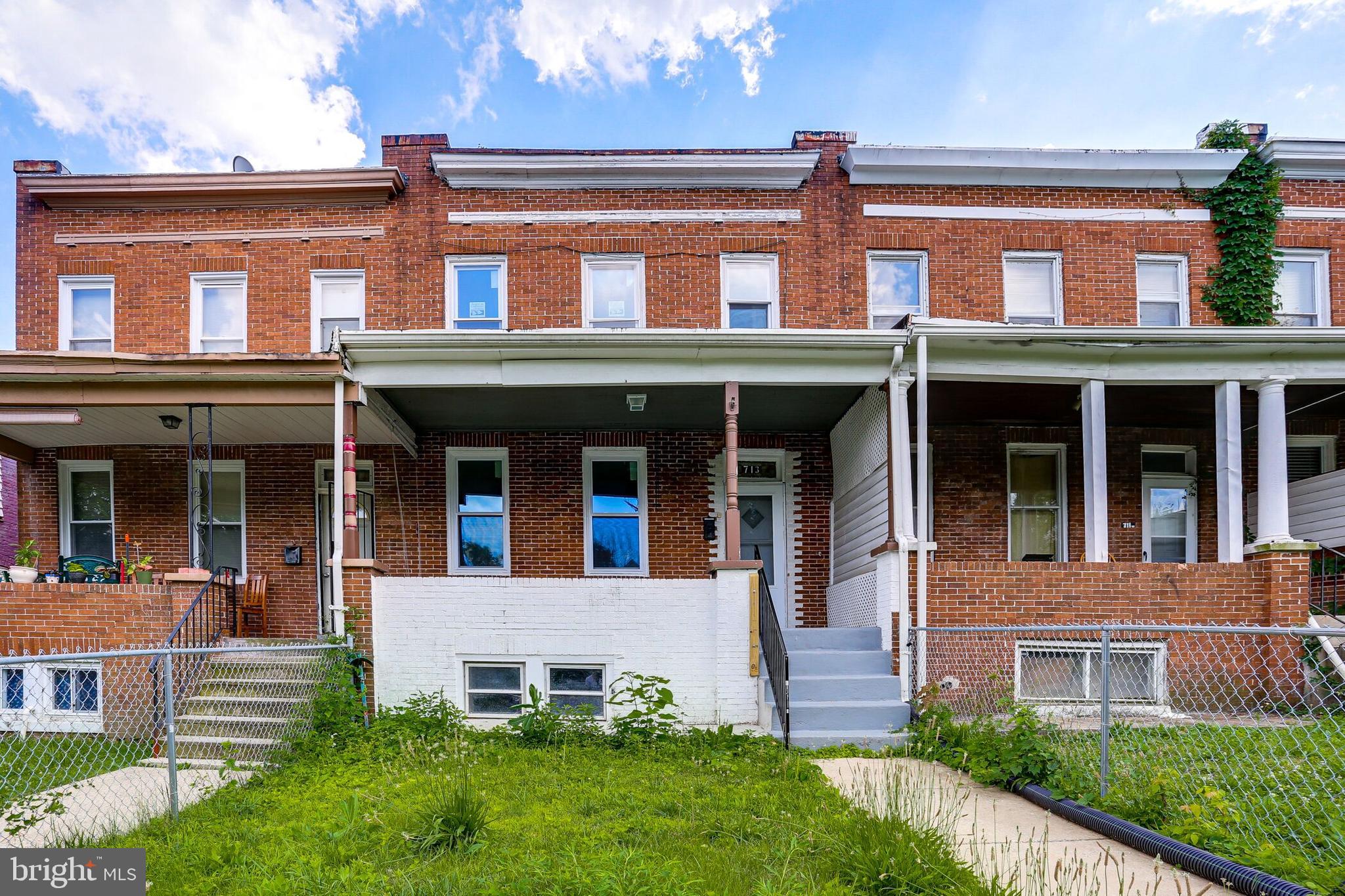 713 Springfield Avenue Baltimore, MD 21212 - Photo 4 of 28 front view of an houses with a yard