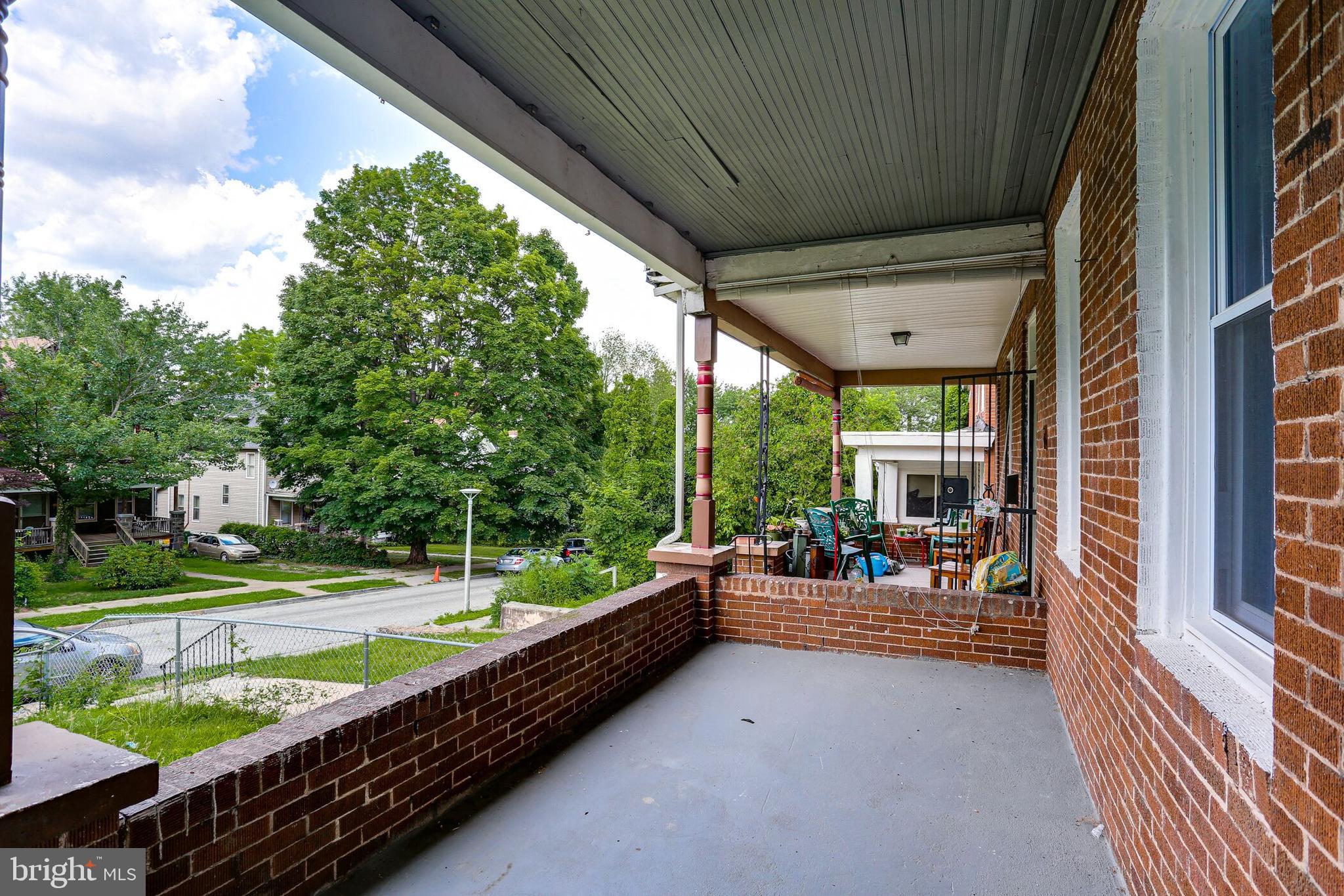 713 Springfield Avenue Baltimore, MD 21212 - Photo 5 of 28 a swimming pool with outdoor seating and yard