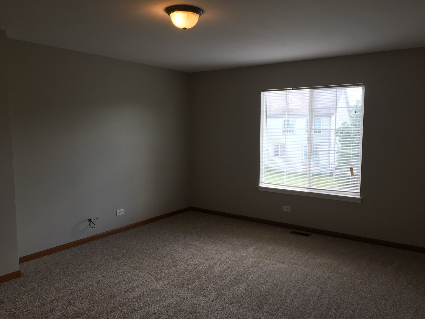 Undisclosed Address Round Lake, IL 60073 - Photo 12 of 29 an empty room with a window
