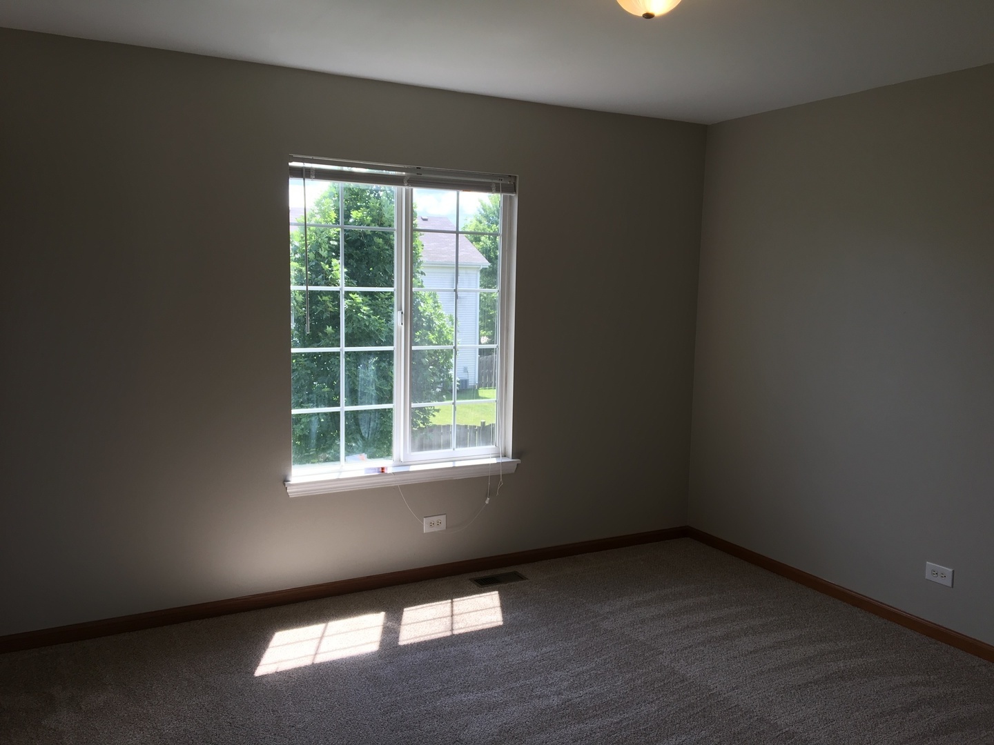 Undisclosed Address Round Lake, IL 60073 - Photo 17 of 29 an empty room with a window