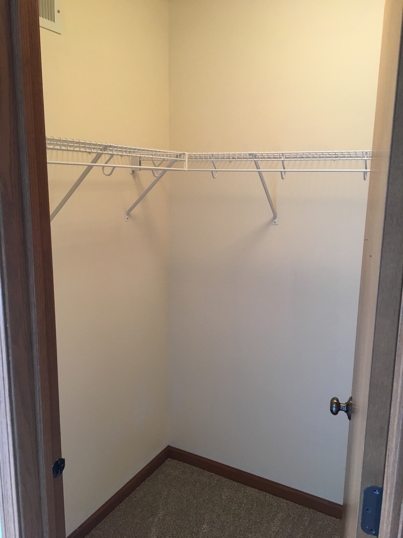 Undisclosed Address Round Lake, IL 60073 - Photo 22 of 29 a view of small space with racks on the wall