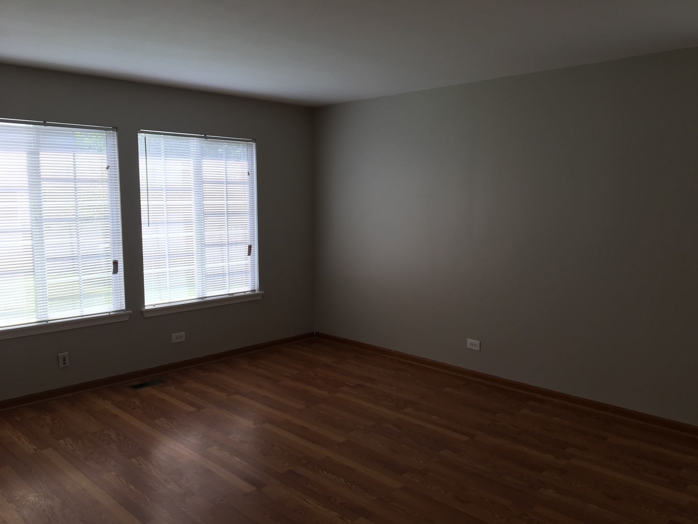 Undisclosed Address Round Lake, IL 60073 - Photo 8 of 29 an empty room with wooden floor and windows
