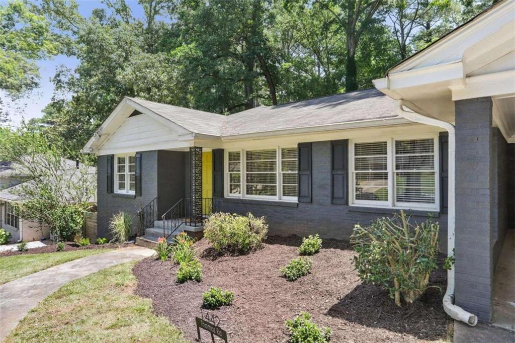 1442 Thomas Road Decatur, GA 30030 - Photo 1 of 1 a front view of a house with garden