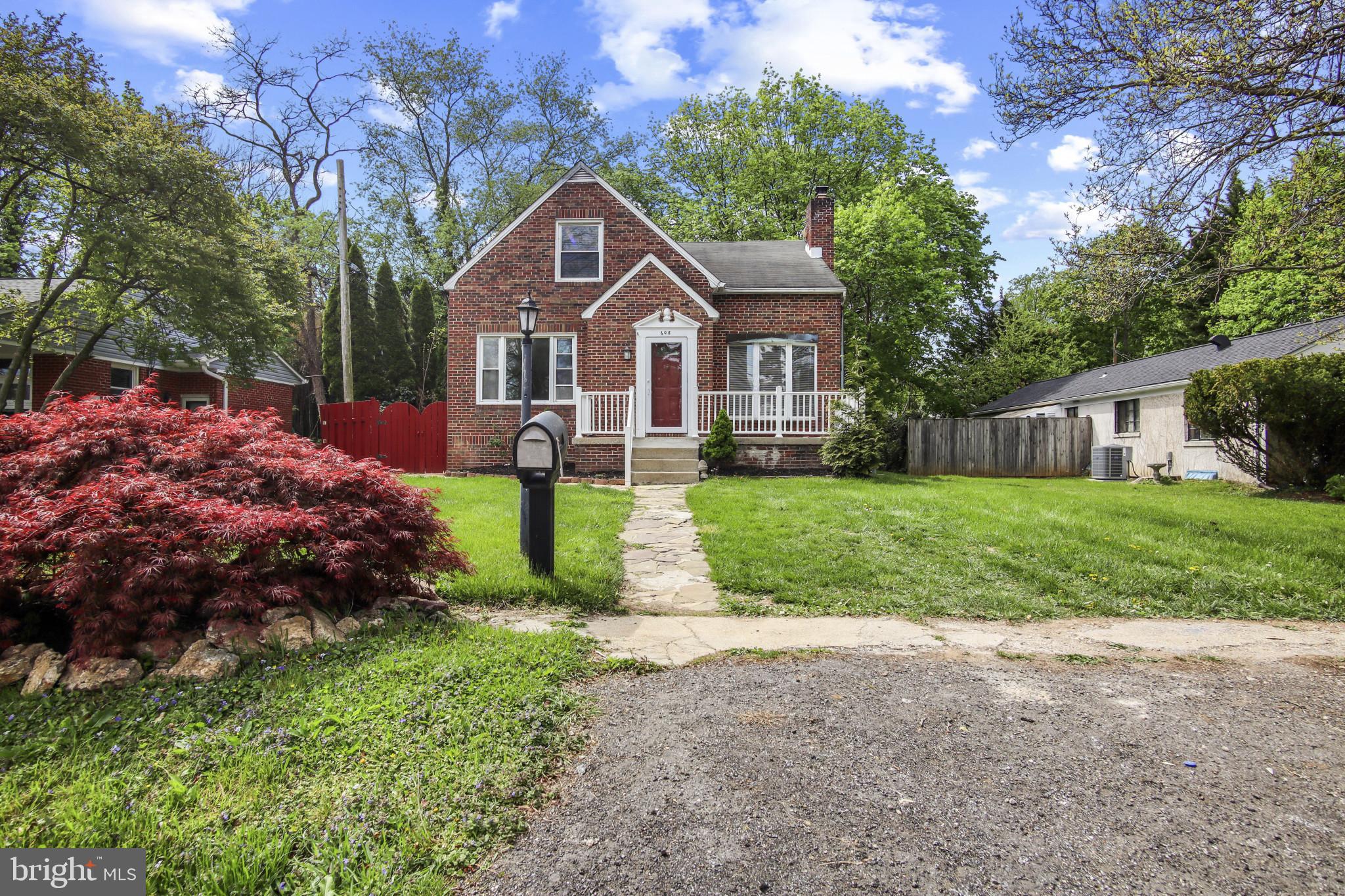 608 Farmhurst Road Baltimore, MD 21208 - Photo 2 of 45 a front view of house with yard and green space