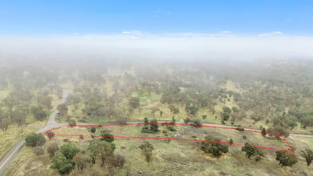 a view of yard covered with snow in outdoor space