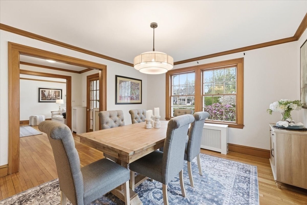 238 Harris Avenue Needham, MA 02492 - Photo 12 of 35 a dining room with furniture a chandelier and wooden floor