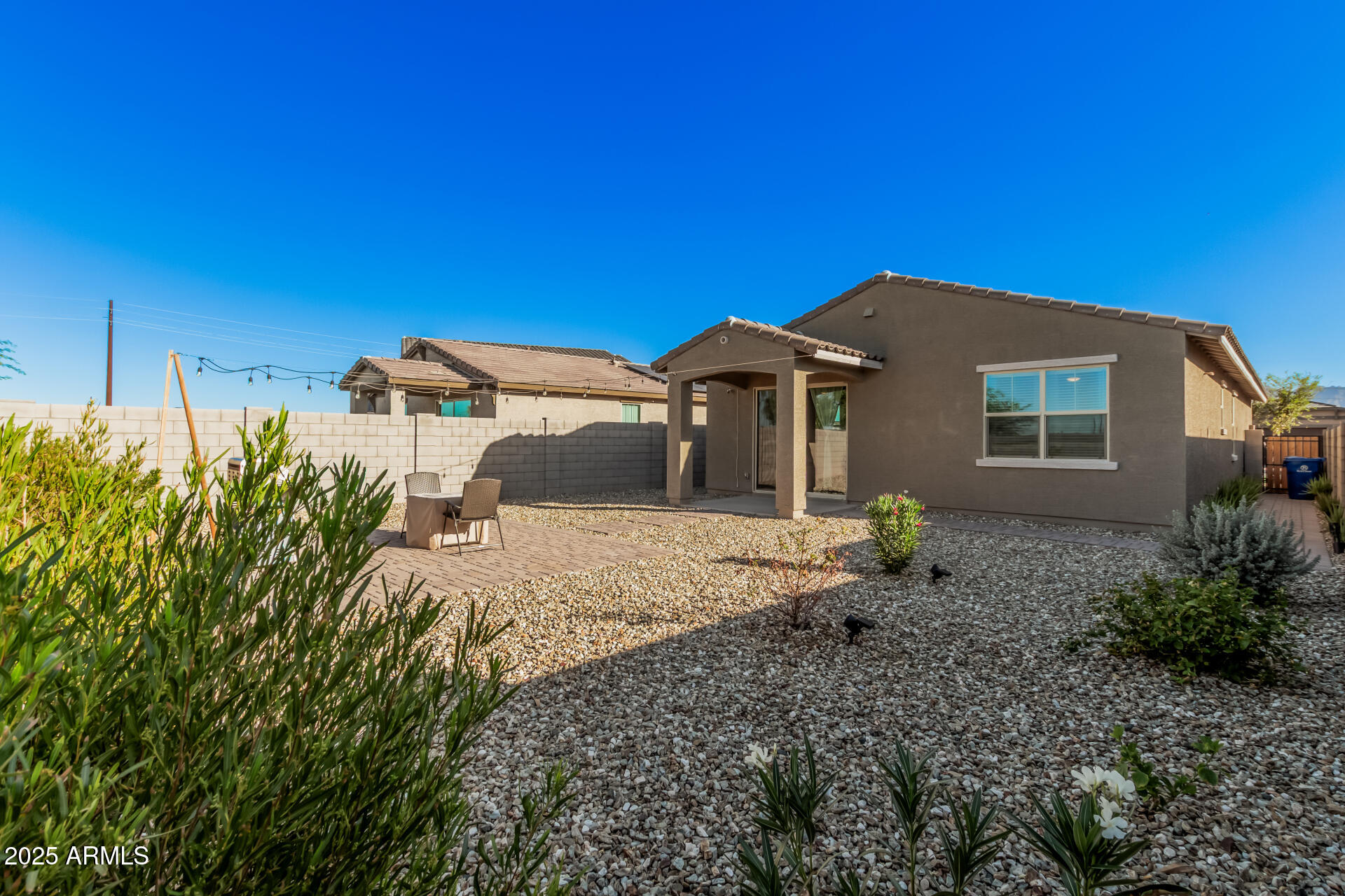 10736 West Chipman Road Tolleson, AZ 85353 - Photo 24 of 27 a front view of a house with a yard