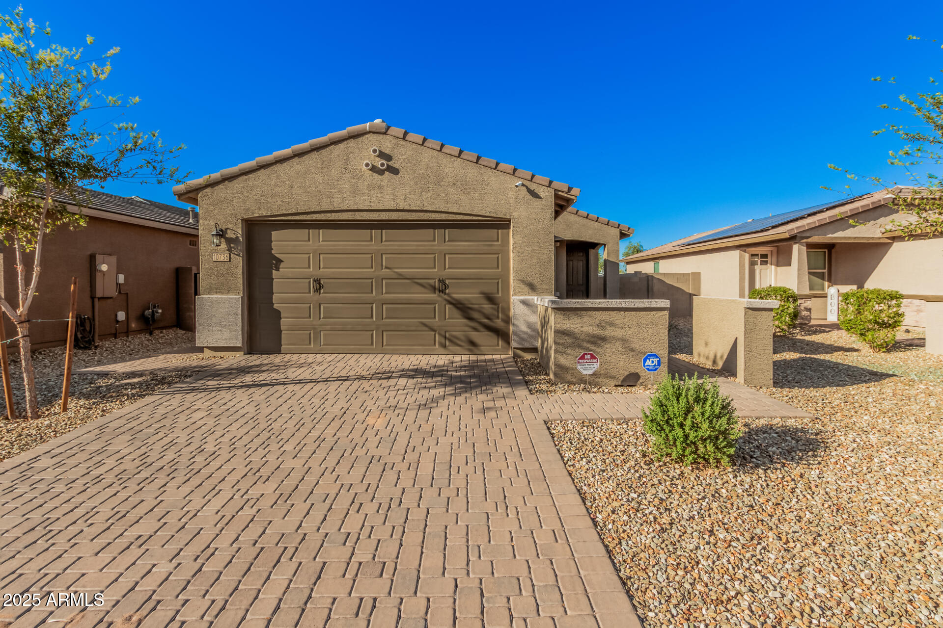 10736 West Chipman Road Tolleson, AZ 85353 - Photo 2 of 27 a front view of a house with a yard