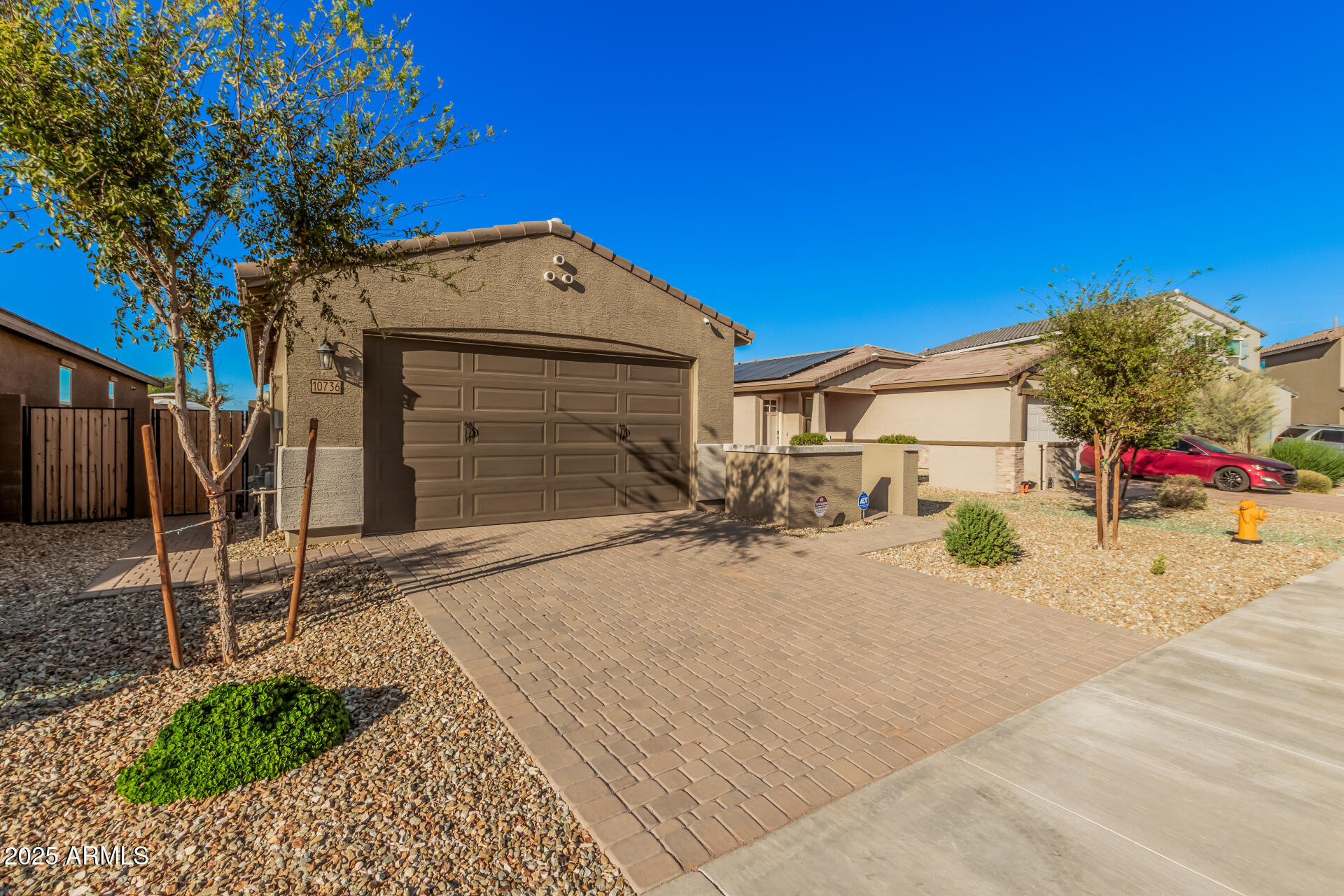 10736 West Chipman Road Tolleson, AZ 85353 - Photo 4 of 27 a view of a house with a yard