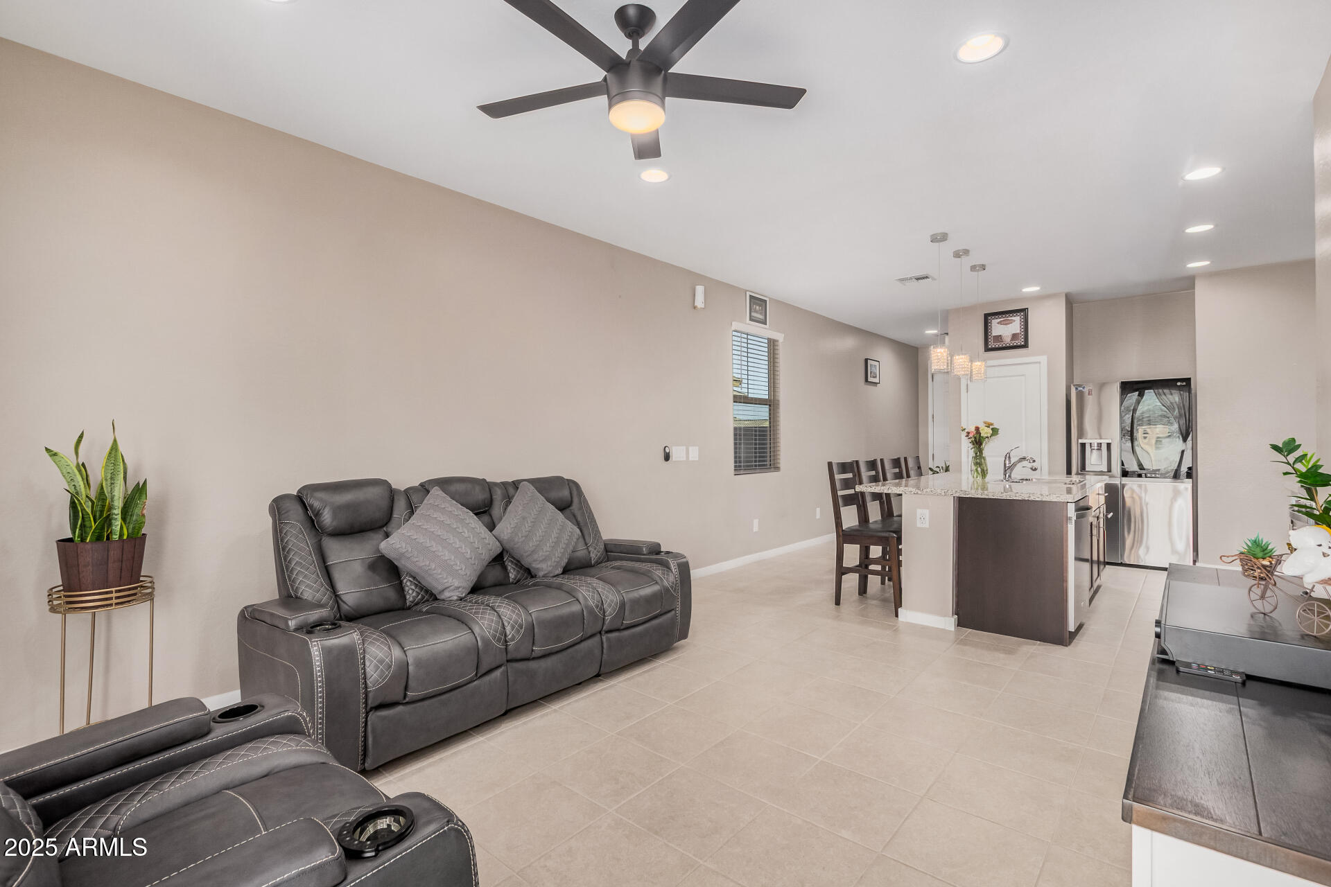 10736 West Chipman Road Tolleson, AZ 85353 - Photo 7 of 27 a living room with furniture and a table