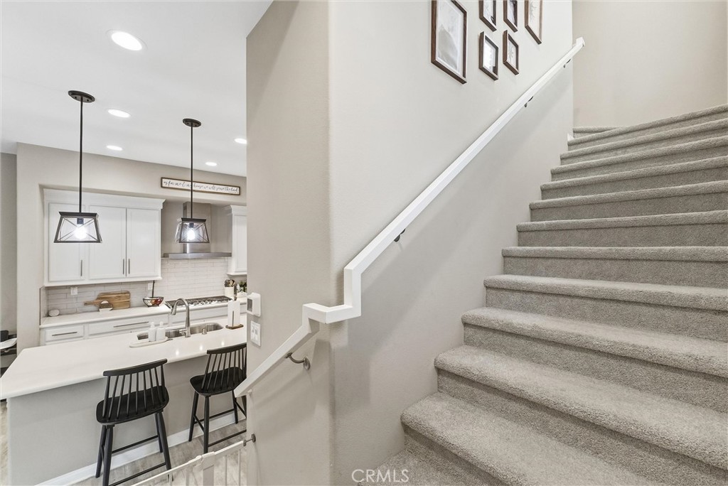 155 Spectacle Irvine, CA 92618 - Photo 13 of 40 a view of hall and dining room with stairs
