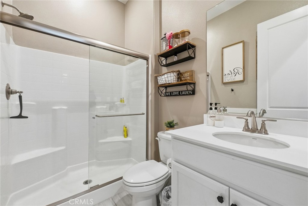 155 Spectacle Irvine, CA 92618 - Photo 19 of 40 a bathroom with a sink a toilet and shower
