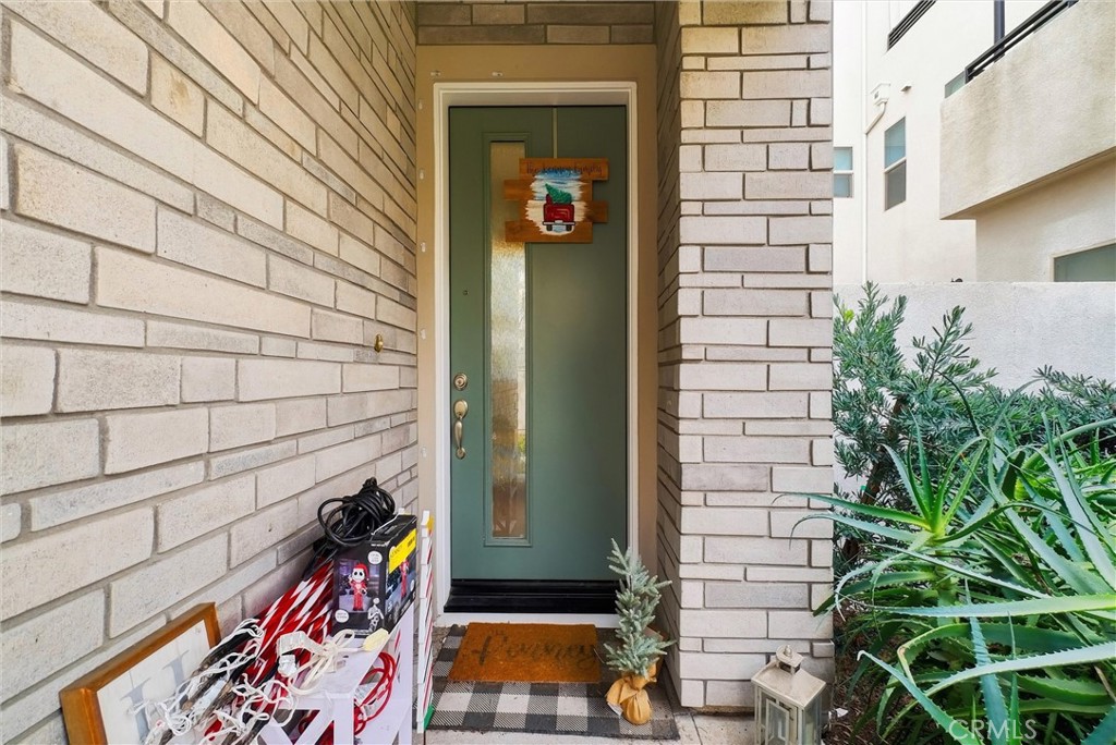 155 Spectacle Irvine, CA 92618 - Photo 2 of 40 a potted plant sitting in front of a door