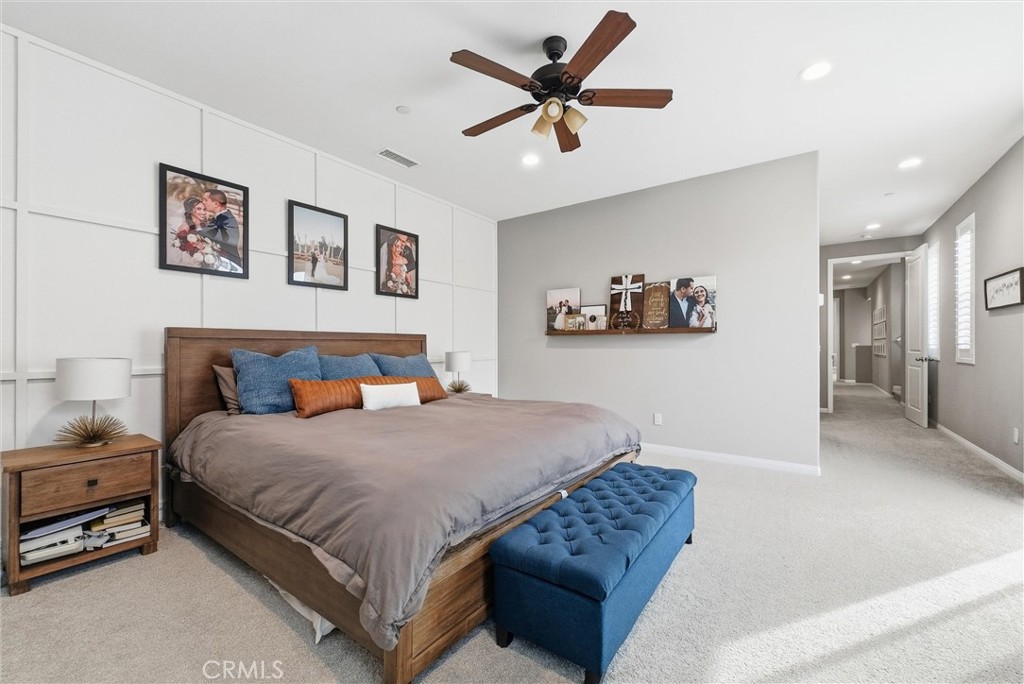 155 Spectacle Irvine, CA 92618 - Photo 26 of 40 a bedroom with a bed and a painting on the wall