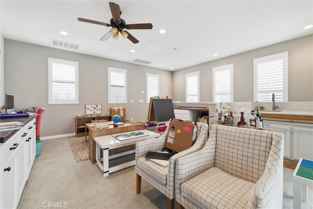 155 Spectacle Irvine, CA 92618 - Photo 33 of 40 a living room with furniture and a window