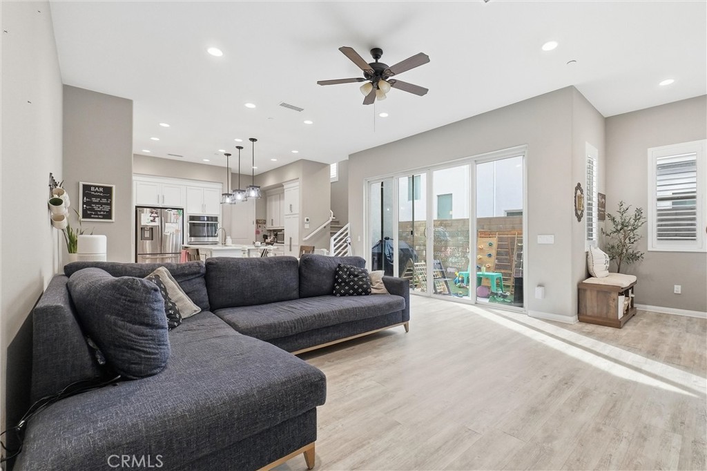 155 Spectacle Irvine, CA 92618 - Photo 4 of 40 a living room with furniture and a large window