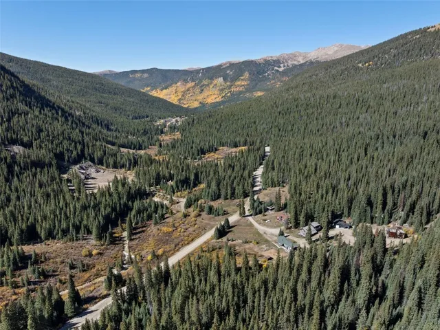 a view of a town with mountains in the background