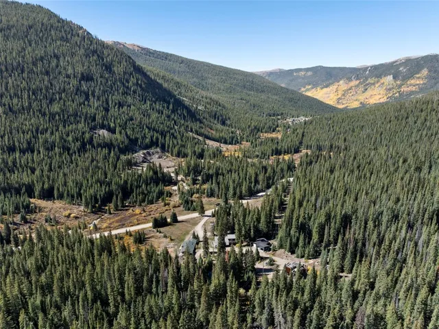 a view of a town with mountains in the background