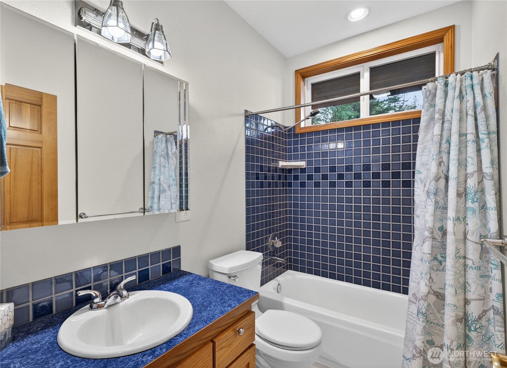 4623 Guemes Island Road Anacortes, WA 98221 - Photo 22 of 40 a bathroom with a sink a toilet and shower