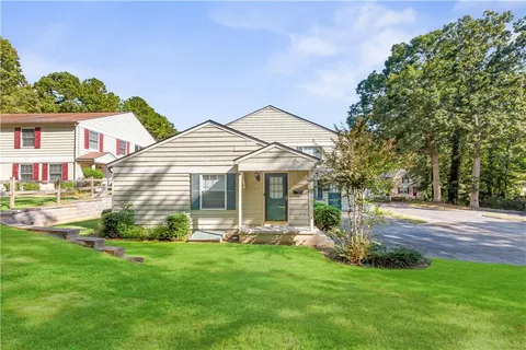 a front view of house with yard and outdoor seating
