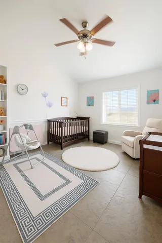 a bedroom with furniture a rug and a window