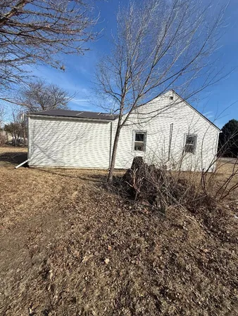 a view of a backyard of the house