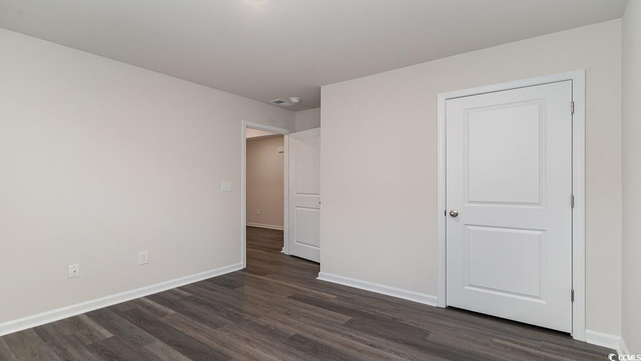 6047 Fuller Rdg Court Conway, SC 29526 - Photo 19 of 26 Unfurnished bedroom featuring dark wood-type floor