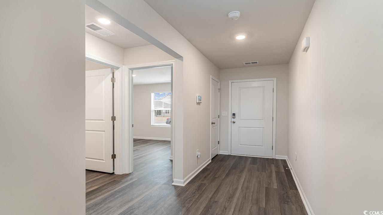 6047 Fuller Rdg Court Conway, SC 29526 - Photo 2 of 26 Corridor featuring dark hardwood / wood-style floo