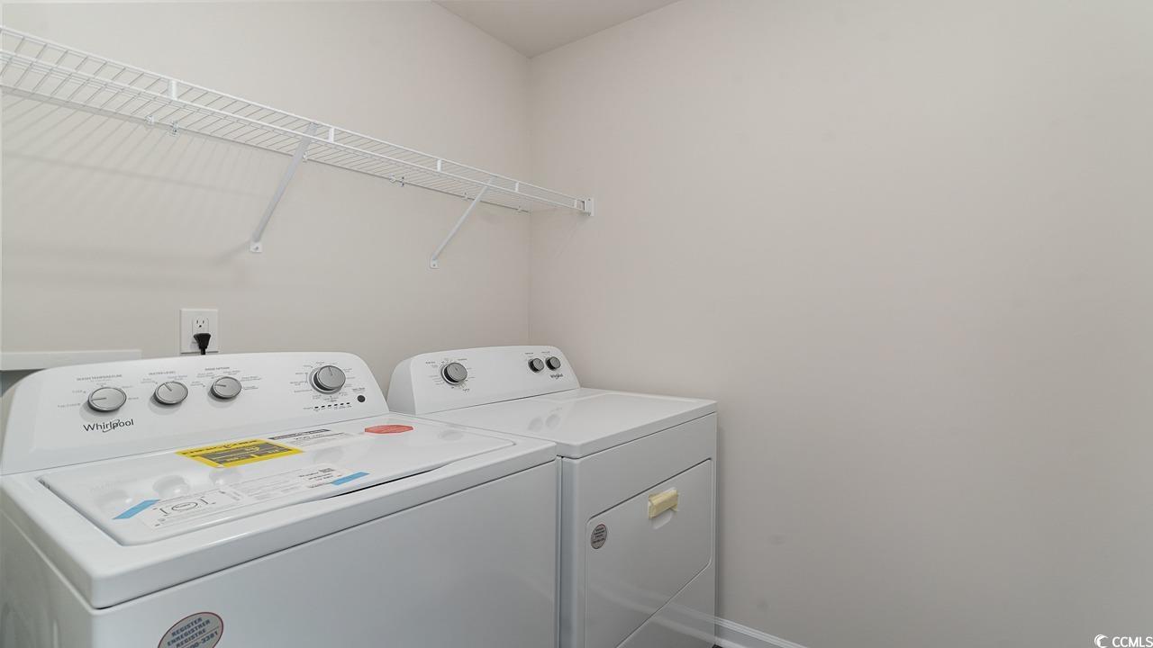 6047 Fuller Rdg Court Conway, SC 29526 - Photo 23 of 26 Laundry room with washing machine and clothes drye