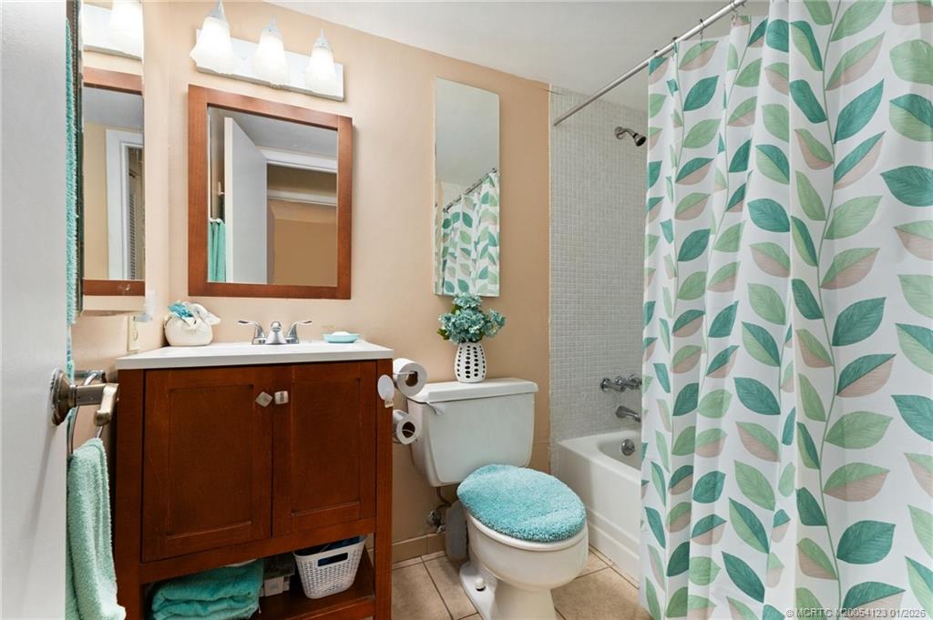 1980 Southwest Palm City Road, Unit 50J Stuart, FL 34994 - Photo 20 of 37 a bathroom with a sink toilet and shower